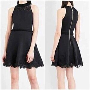 Ted Baker fit & flare black sleeveless dress with lace around hem & neckline.
